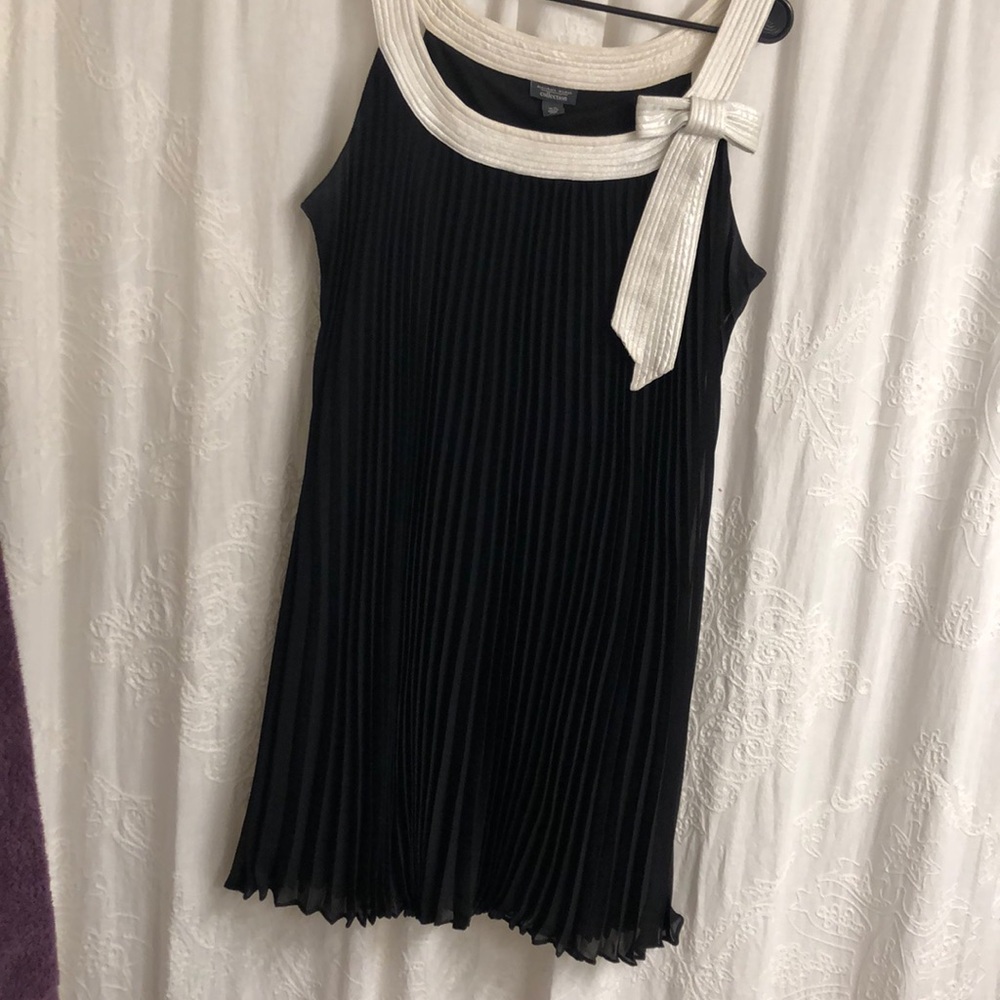 Black shift dress with white bow